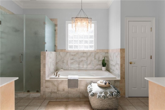 bathroom with tile patterned floors, independent shower and bath, crown molding, and a chandelier