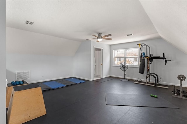 workout area featuring vaulted ceiling and ceiling fan