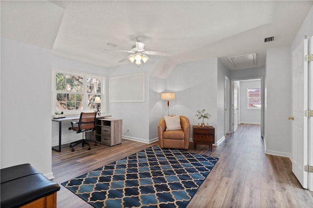 home office featuring ceiling fan, wood-type flooring, and lofted ceiling