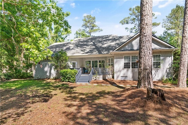 back of house with stucco siding