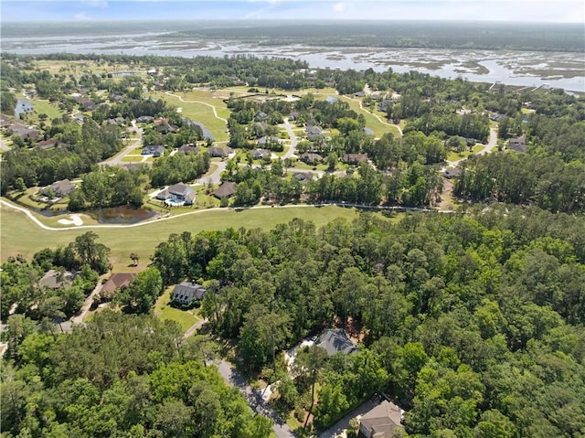drone / aerial view with a residential view and view of golf course