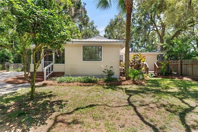 315 Pine St, Saint Simons Island, GA 31522 - view of front of property with a metal roof