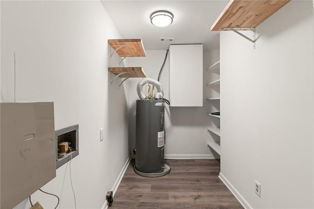 315 Pine St, Saint Simons Island, GA 31522 - utility room featuring electric water heater