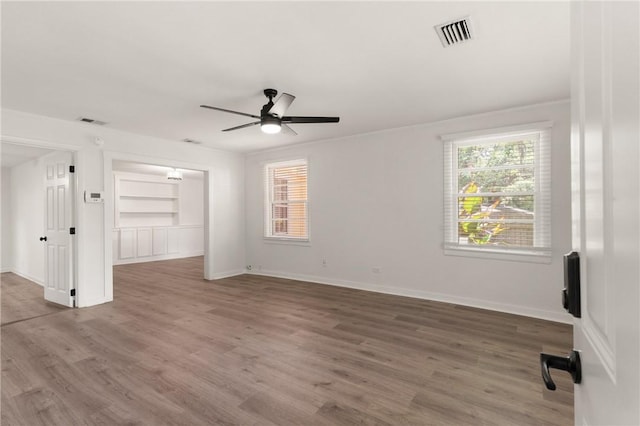 315 Pine St, Saint Simons Island, GA 31522 - spare room featuring a ceiling fan, plenty of natural light, and wood finished floors