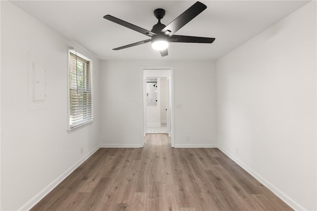 315 Pine St, Saint Simons Island, GA 31522 - empty room with wood finished floors, a ceiling fan, and electric panel