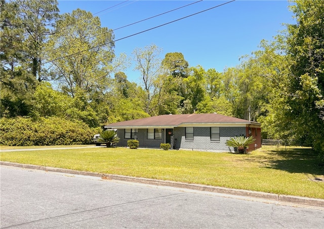 single story home with a front yard