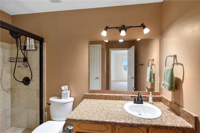 109 Mackay Cir, Brunswick, GA 31525 - bathroom with a tile shower, vanity, and toilet