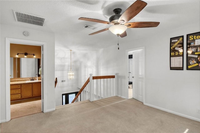 109 Mackay Cir, Brunswick, GA 31525 - carpeted empty room with a textured ceiling, sink, and ceiling fan with notable chandelier