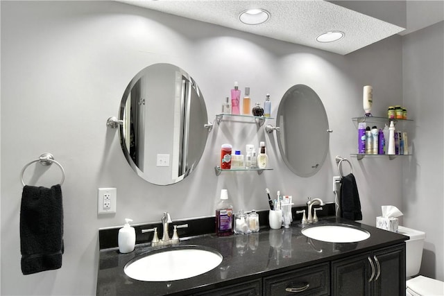 109 Mackay Cir, Brunswick, GA 31525 - bathroom with vanity, a textured ceiling, and toilet