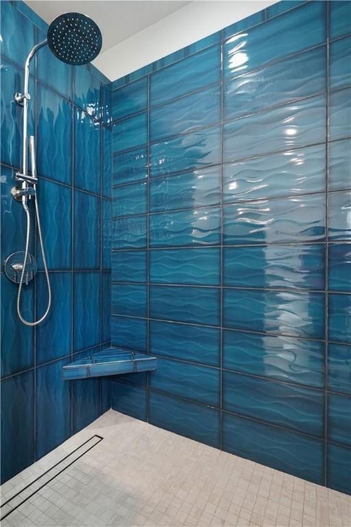 bathroom with tiled shower