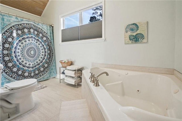 full bathroom featuring lofted ceiling, a tub with jets, and toilet