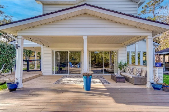 wooden deck with outdoor lounge area