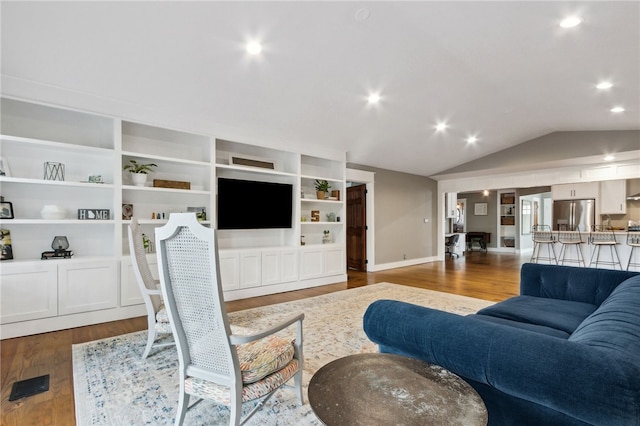 living room with lofted ceiling and wood-type flooring