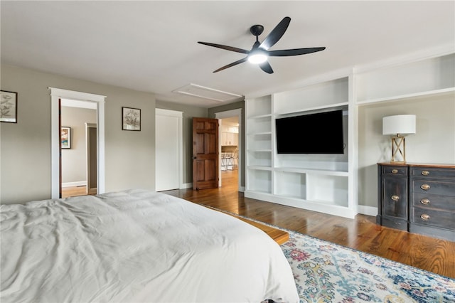 bedroom with ceiling fan and dark hardwood / wood-style flooring