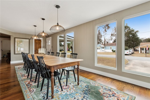 dining space featuring dark hardwood / wood-style flooring