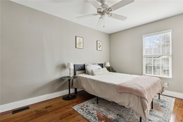 bedroom featuring wood-type flooring and ceiling fan