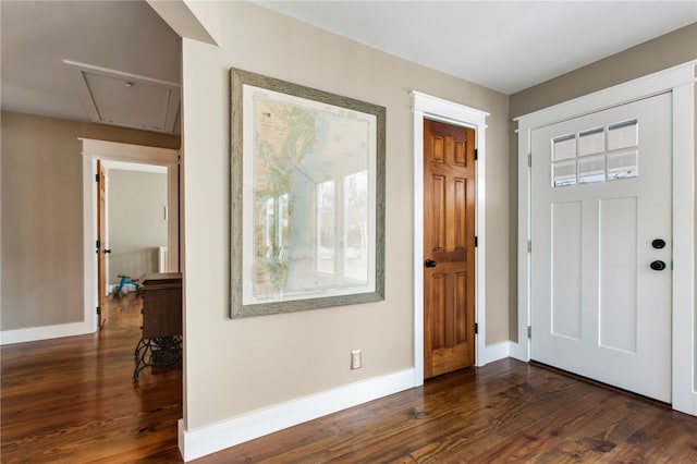 entryway with dark hardwood / wood-style flooring