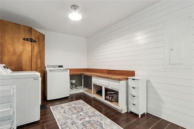 laundry room with washer and dryer and electric panel