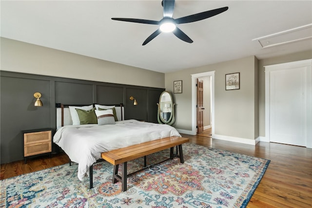 bedroom featuring dark hardwood / wood-style floors and ceiling fan