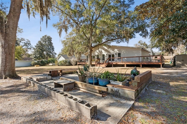 view of yard featuring a wooden deck