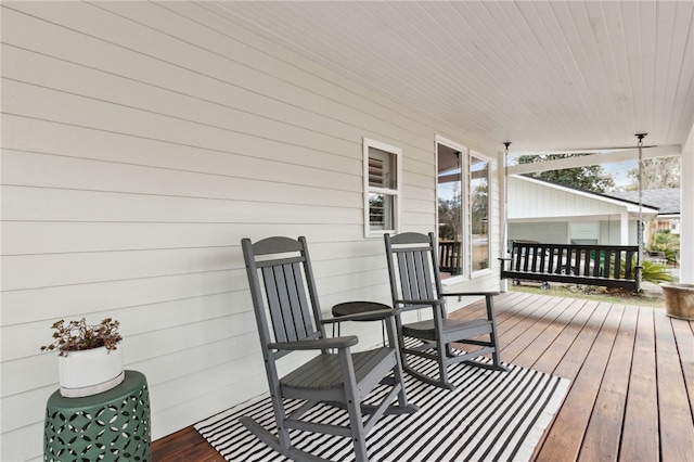 wooden deck featuring covered porch