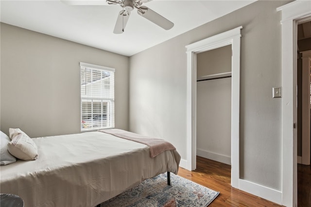 bedroom with hardwood / wood-style flooring and ceiling fan