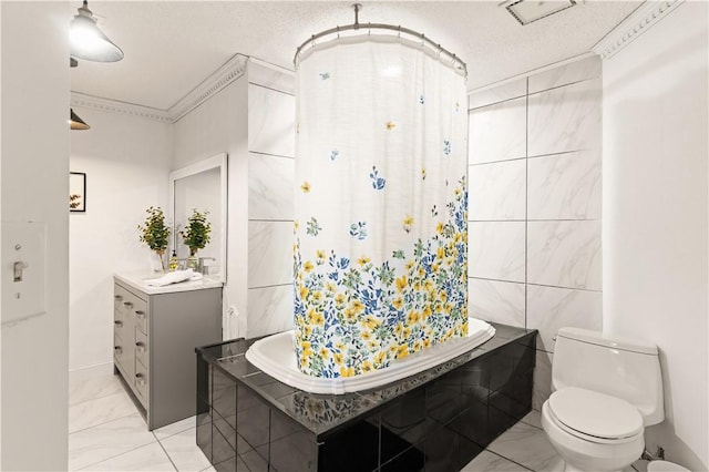 bathroom featuring crown molding, toilet, marble finish floor, and a textured ceiling