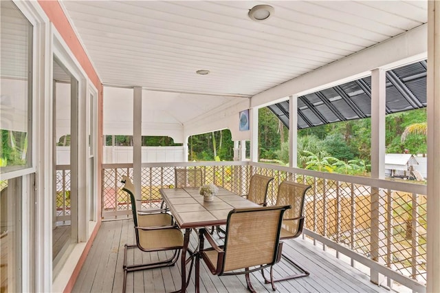 wooden terrace with outdoor dining area