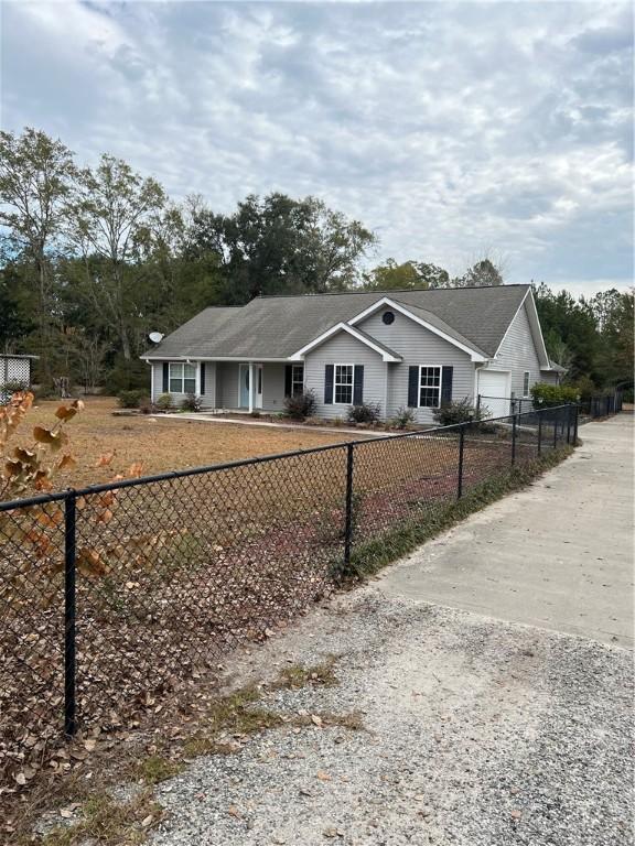 single story home with a garage