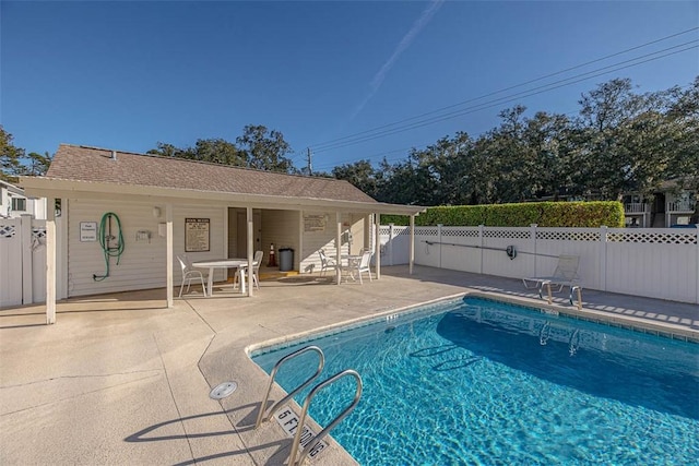 view of swimming pool featuring a patio area