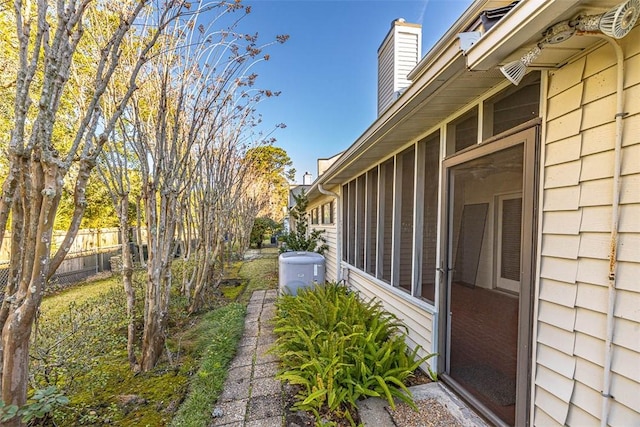 view of side of home with a sunroom