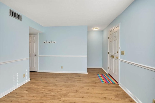 unfurnished room featuring light hardwood / wood-style flooring