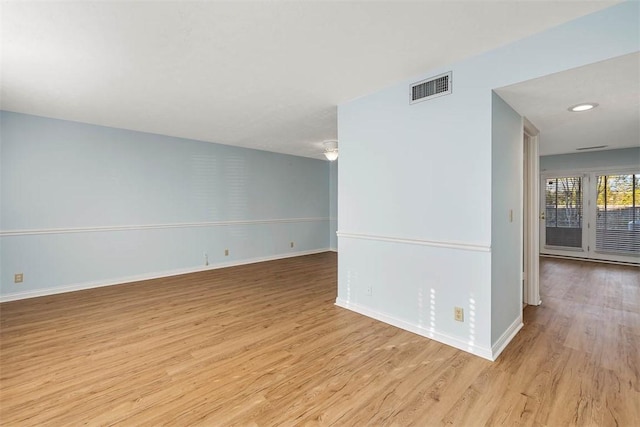 unfurnished room featuring light hardwood / wood-style floors