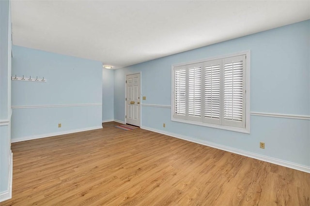 spare room with light wood-type flooring