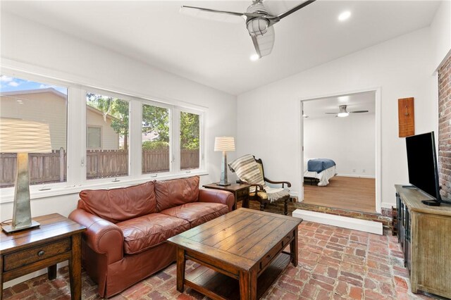 503 Wesley Oak Cir, Saint Simons Island, GA 31522 - living room featuring ceiling fan, vaulted ceiling, brick flooring, baseboards, and recessed lighting