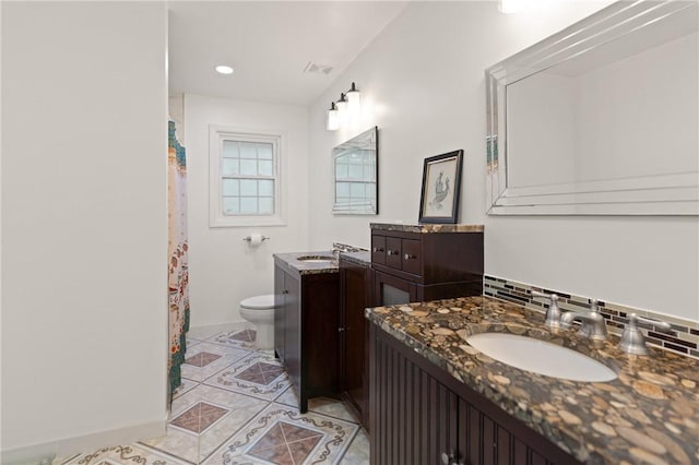 503 Wesley Oak Cir, Saint Simons Island, GA 31522 - bathroom featuring toilet, tile patterned floors, vanity, baseboards, and curtained shower