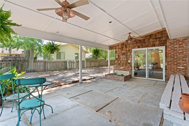view of patio / terrace featuring ceiling fan and fence