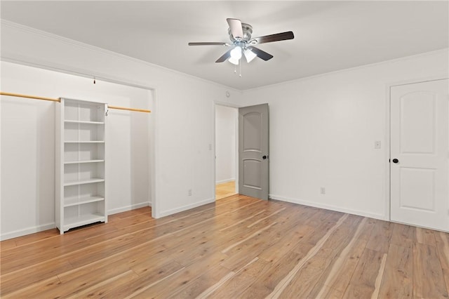 unfurnished bedroom featuring crown molding, baseboards, ceiling fan, and light wood-style flooring