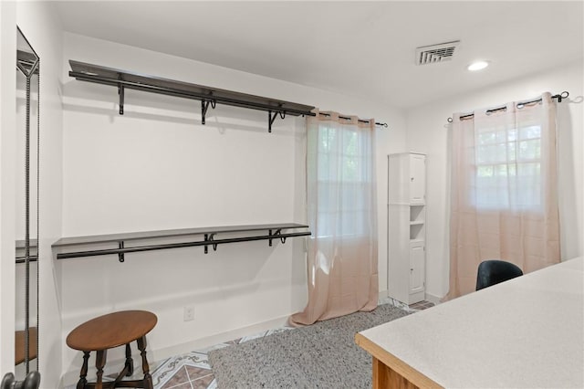 walk in closet featuring visible vents