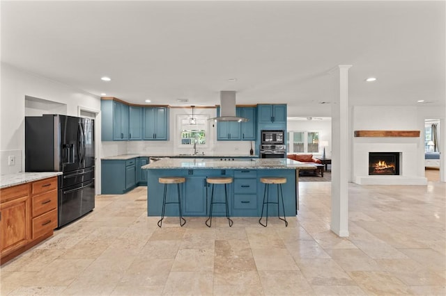kitchen featuring oven, black refrigerator with ice dispenser, built in microwave, island range hood, and a kitchen island
