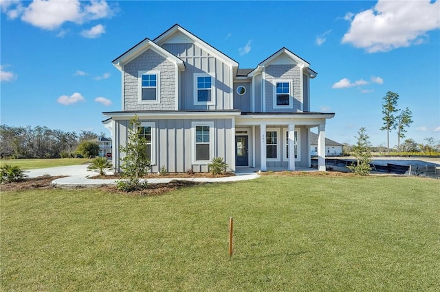 view of front of home featuring a front lawn and a porch