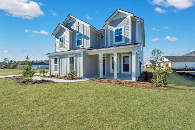 view of front of home featuring a front yard and covered porch