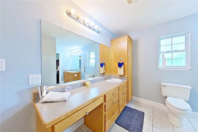 20 Marla St, Hoboken, GA 31542 - bathroom with vanity, baseboards, toilet, and tile patterned floors