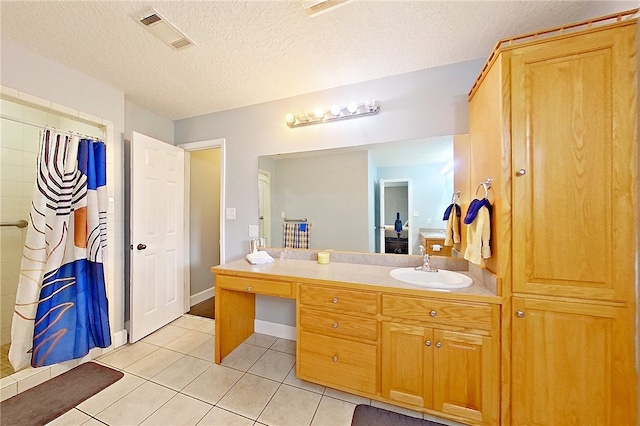 20 Marla St, Hoboken, GA 31542 - full bath featuring tile patterned flooring, vanity, a shower with shower curtain, and a textured ceiling