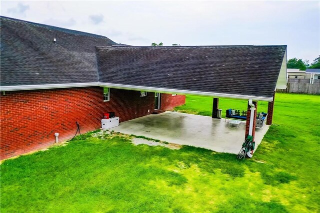 20 Marla St, Hoboken, GA 31542 - exterior space featuring a shingled roof, an attached carport, a lawn, and a patio