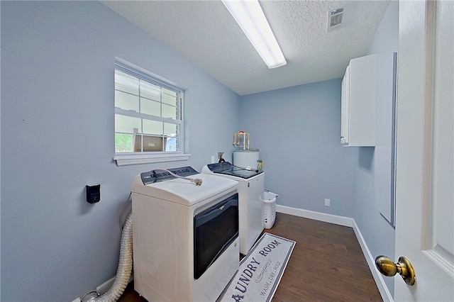 20 Marla St, Hoboken, GA 31542 - laundry area featuring cabinet space, dark wood-style floors, baseboards, independent washer and dryer, and a textured ceiling