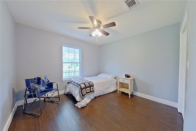 20 Marla St, Hoboken, GA 31542 - bedroom with dark wood-style floors, baseboards, a ceiling fan, and a textured ceiling
