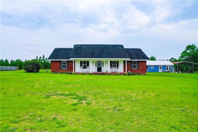 20 Marla St, Hoboken, GA 31542 - view of front of house with covered porch, brick siding, and a front yard