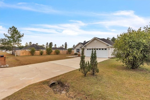 view of front of home featuring a garage and a front lawn