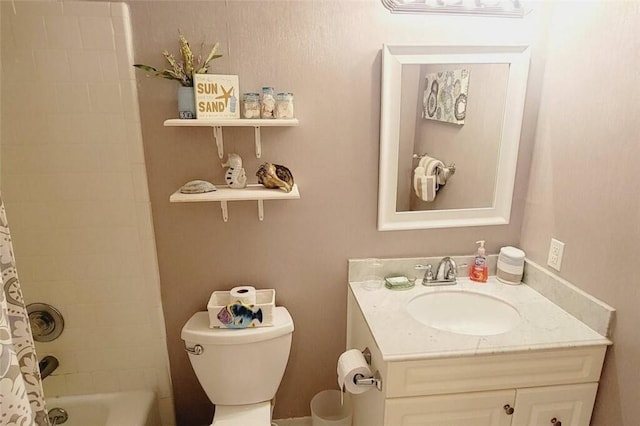 full bathroom with vanity, shower / tub combo, and toilet